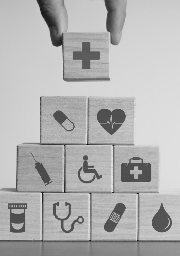 stack of blocks with healthcare icons