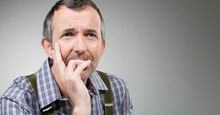 Older man sitting and thinking